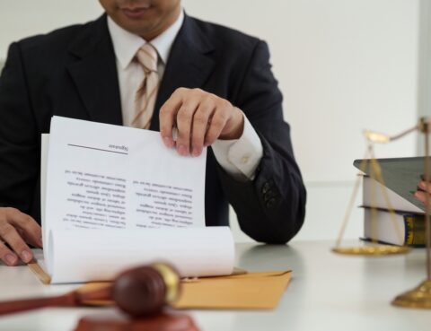 Attorney reviewing documents with client to prevent personal injury claim mistakes