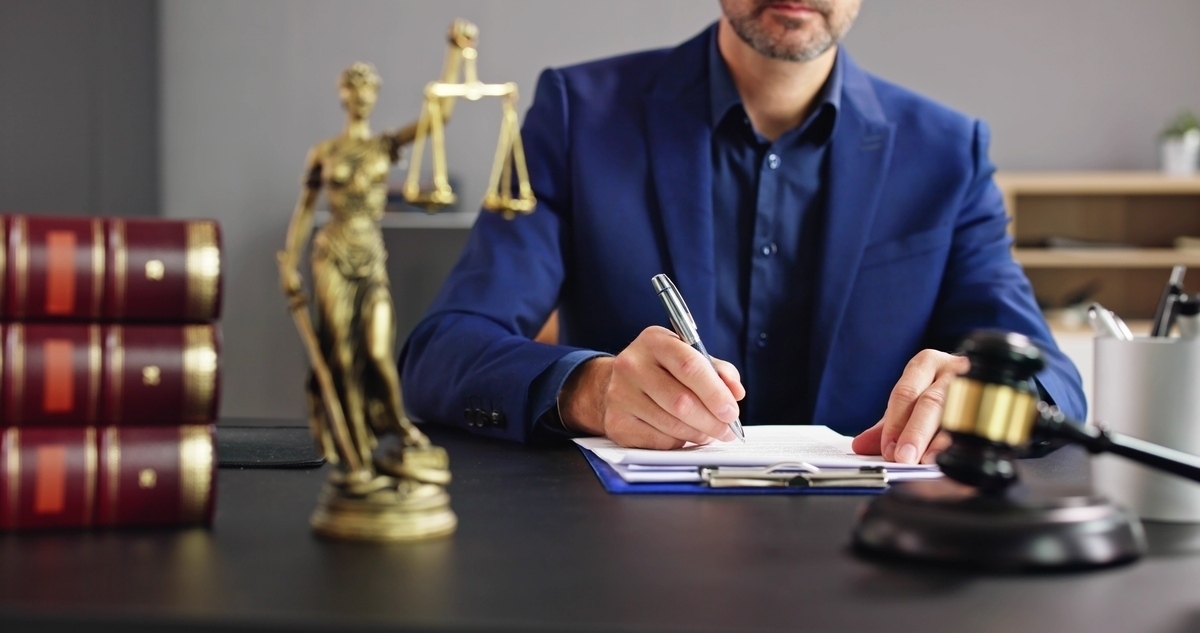 Personal injury demand letter being drafted by an attorney in a professional legal office