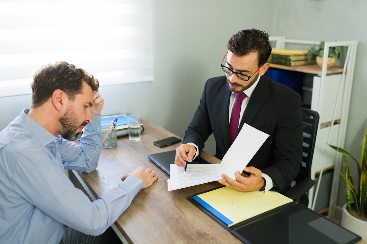 Attorney reviewing a case with a client to explain dog bite liability in NY