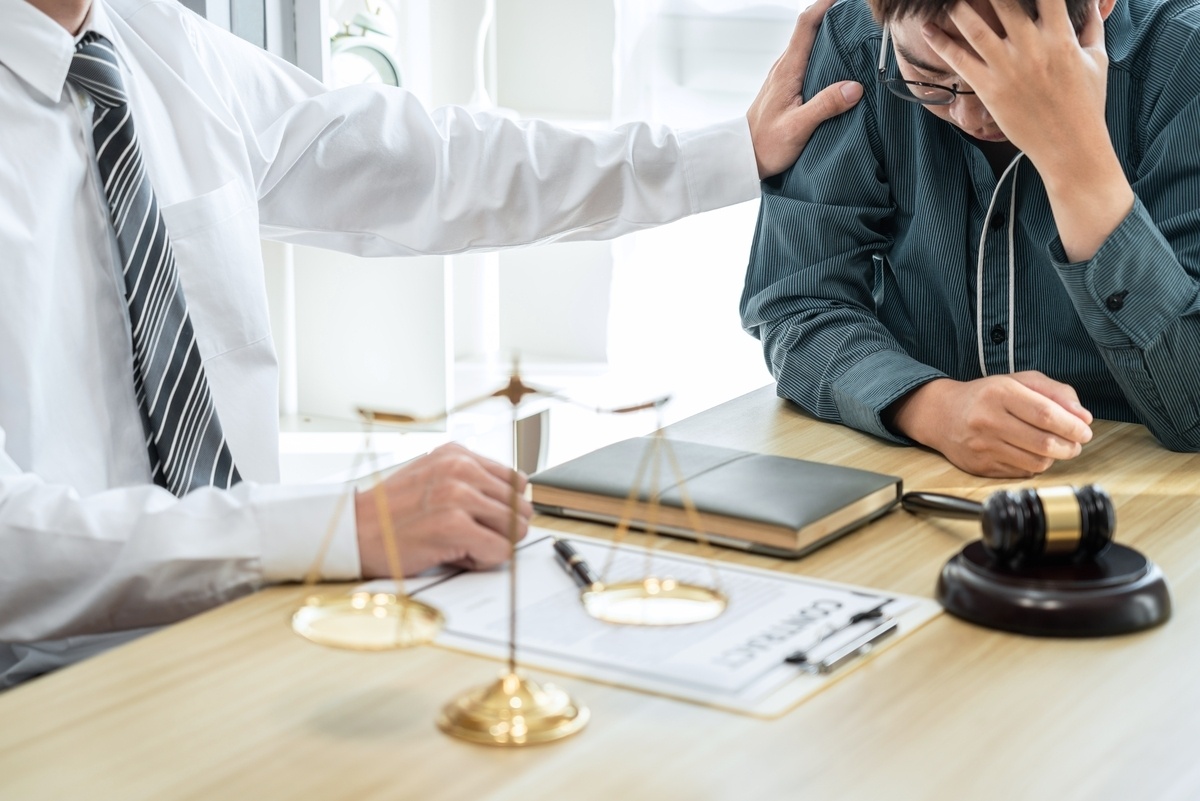 Wrongful death lawyer in White Plains NY comforting a grieving client during a consultation