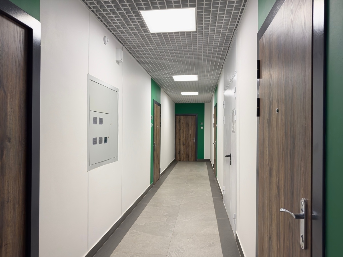 Multi-unit apartment building hallway, illustrating landlord liability for dog bites in shared buildings